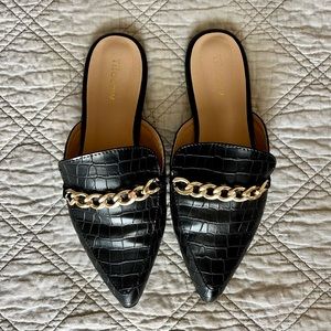 Black crocodile mules with gold chain